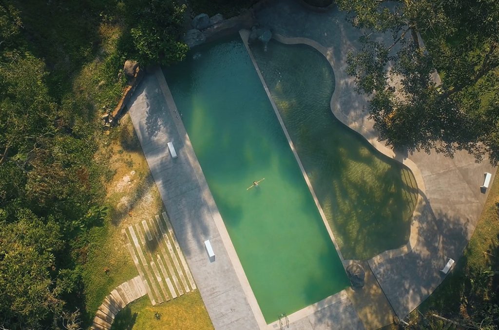 Aerial view of a Sementra hot spring pool in the forest