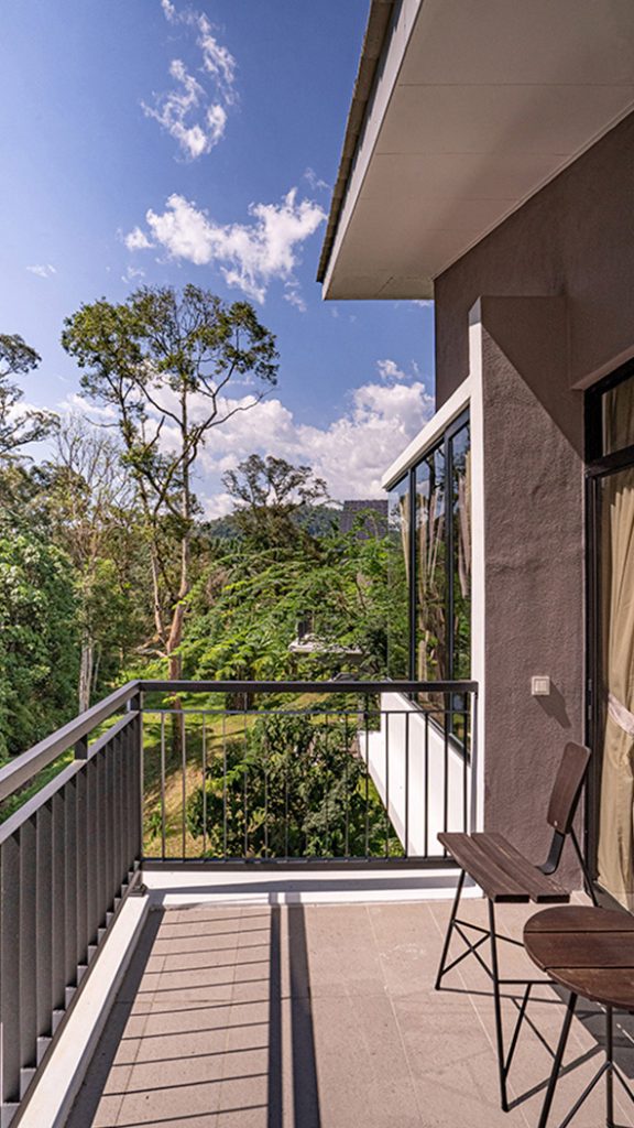 Sementra villa balcony with a forest view