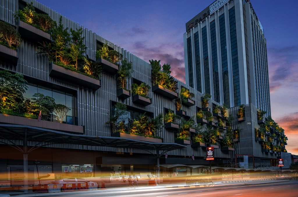Hotel facade with vertical greenery at dusk, Sunray build, architectural photography by Creo