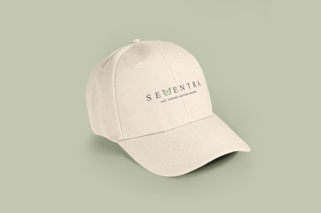 Sementra logo embroidered on a cream cap