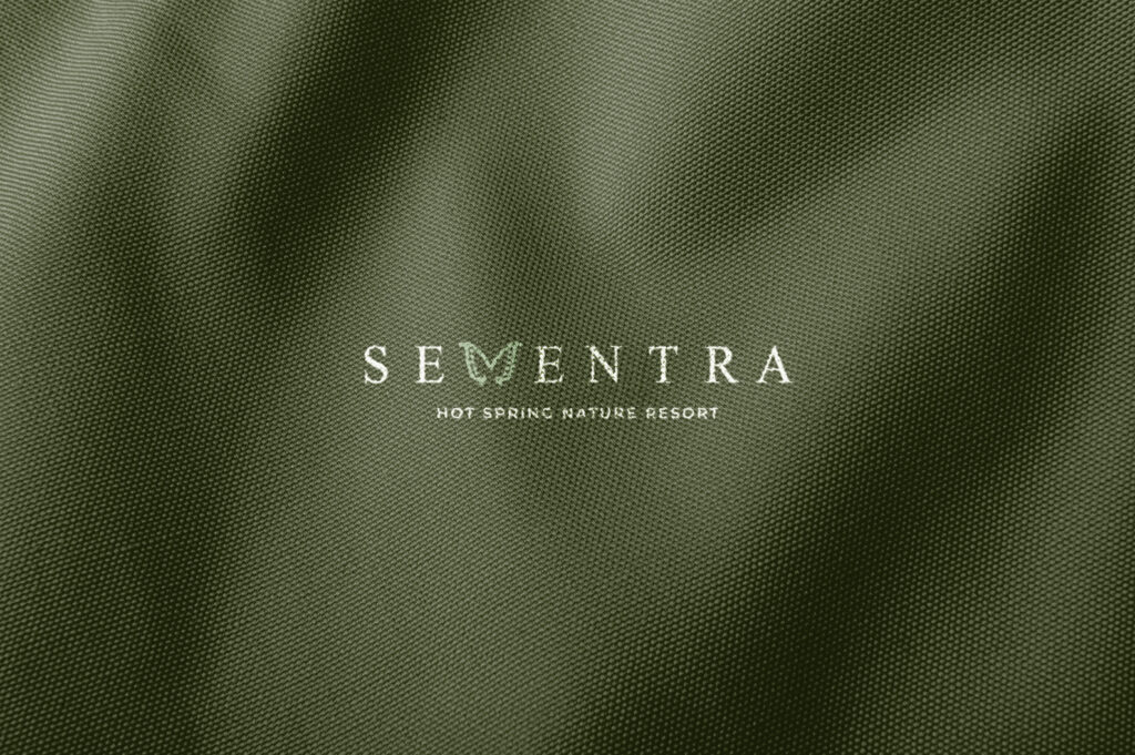 Sementra logo on green fabric
