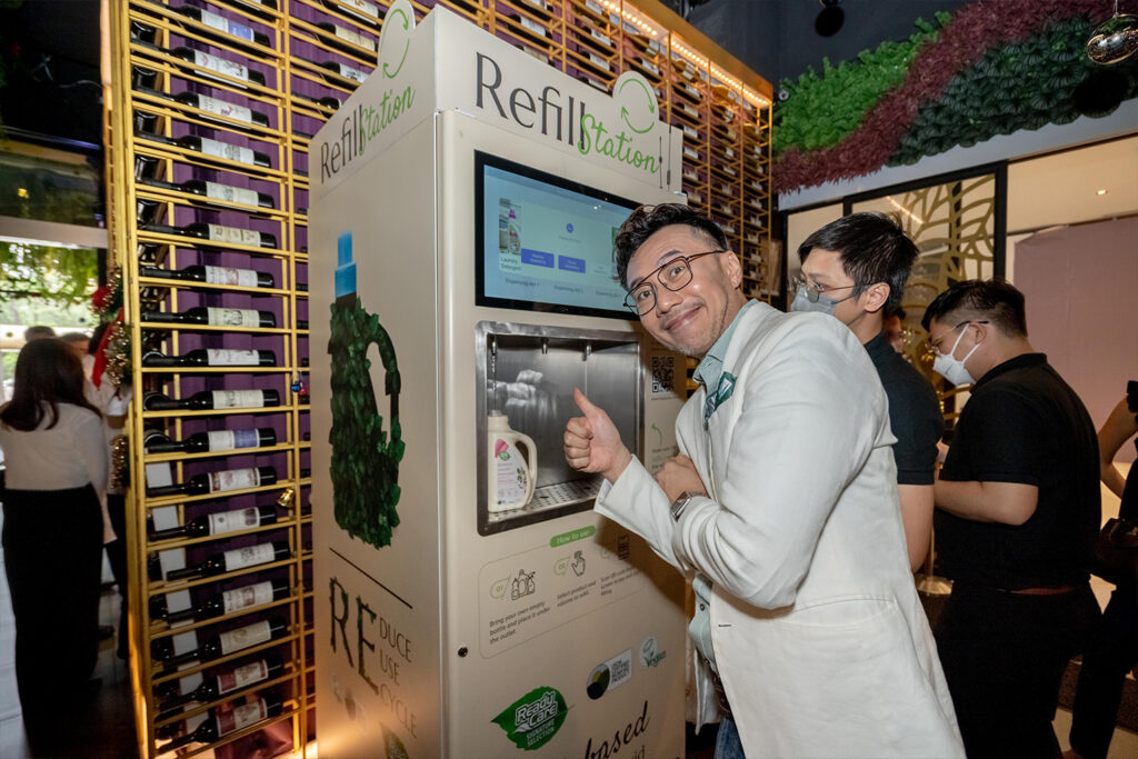 A guest tries the ReadyCare Signature refill station at the brand launch